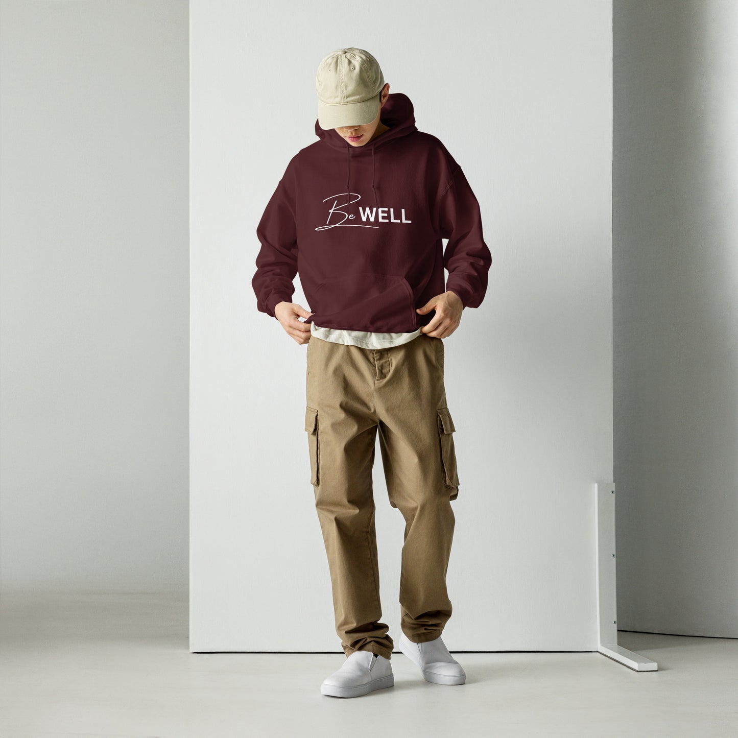 A Unisex BE WELL 1/2 Script Hoodie